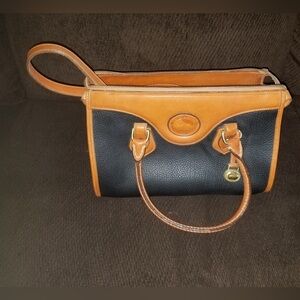 Vintage Dooney & Bourke.
Elegant Black and Tan Leather Handbag